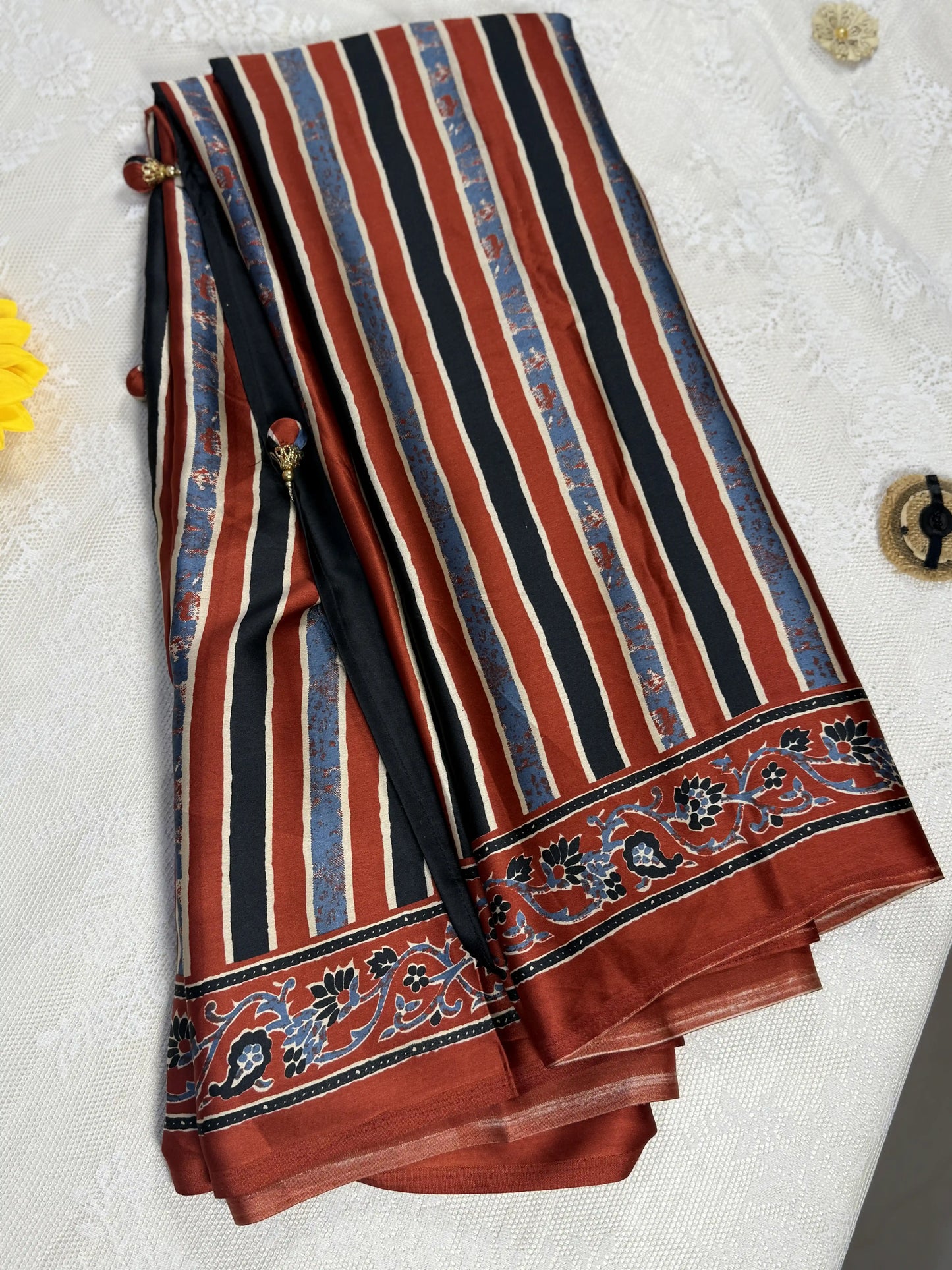 Empress Ajrakh Modal Satin Saree: Pale Gold, Red and Blue Stripped Saree with Blue and Red Marble Body with multi color ajrakh border and pallu