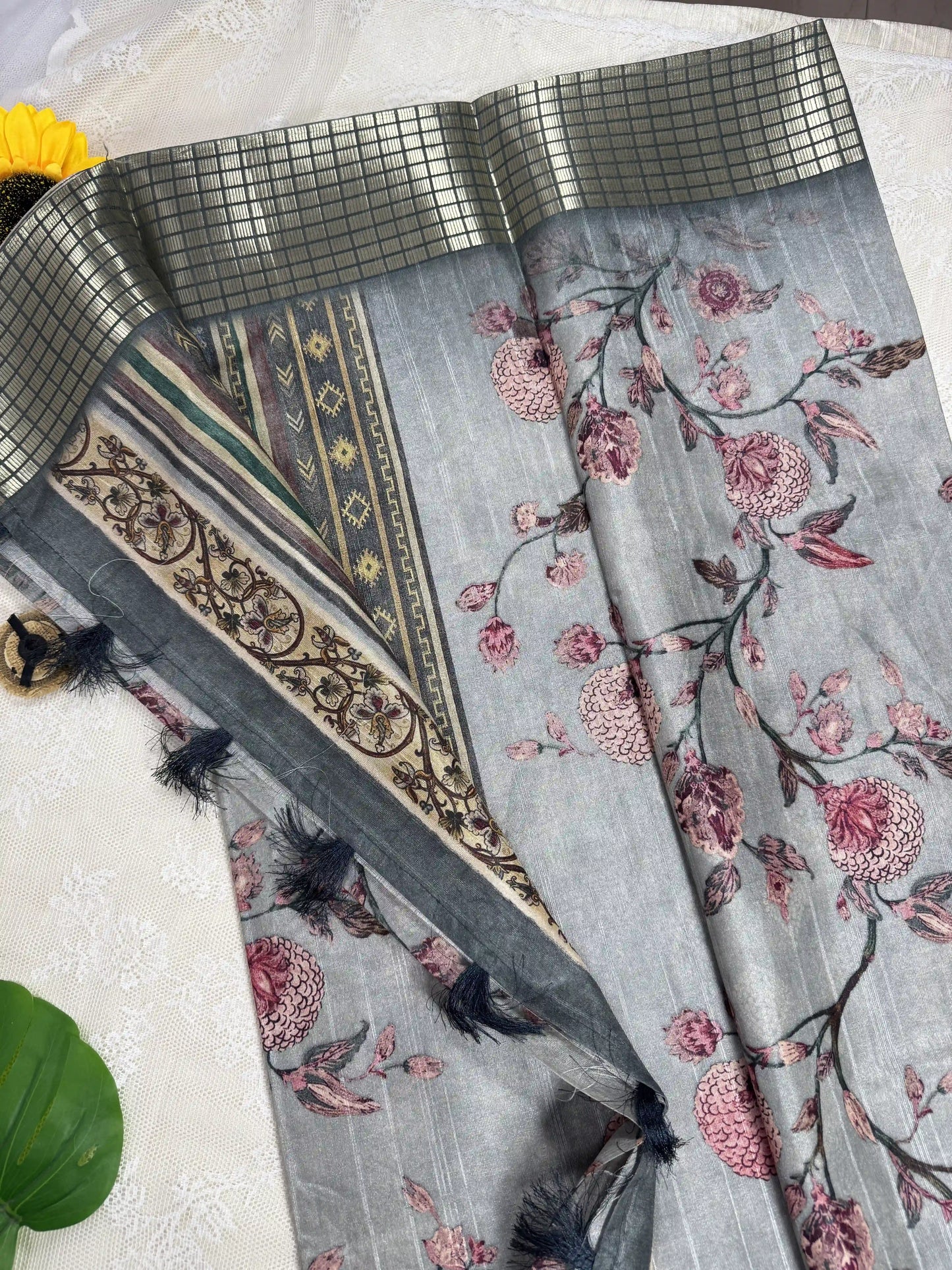Grey Tassar Silk Saree with Floral design body and dark grey border with gold barcode zari work