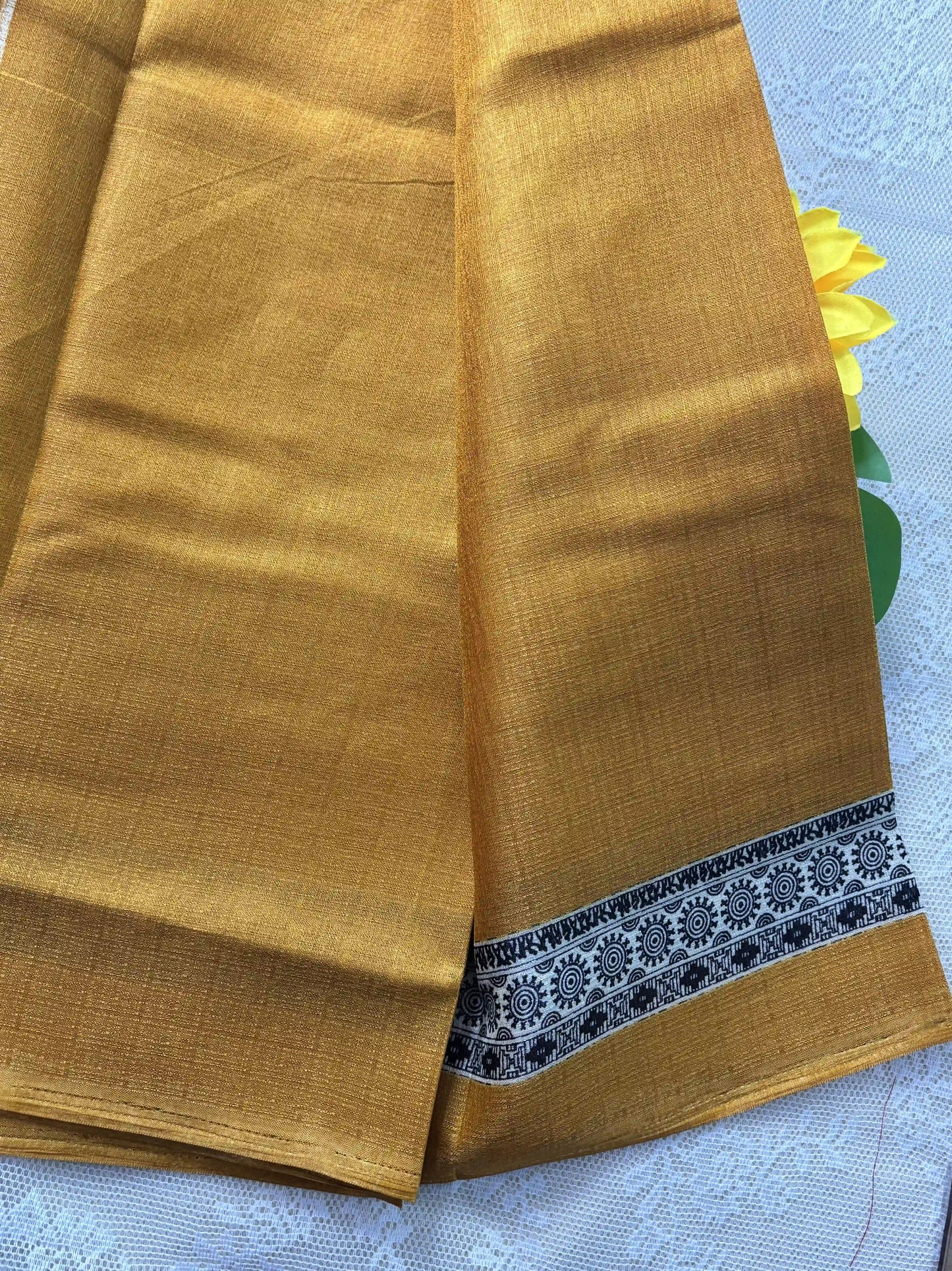 Mustard yellow plain body khadi silk saree with warli print border and pallu