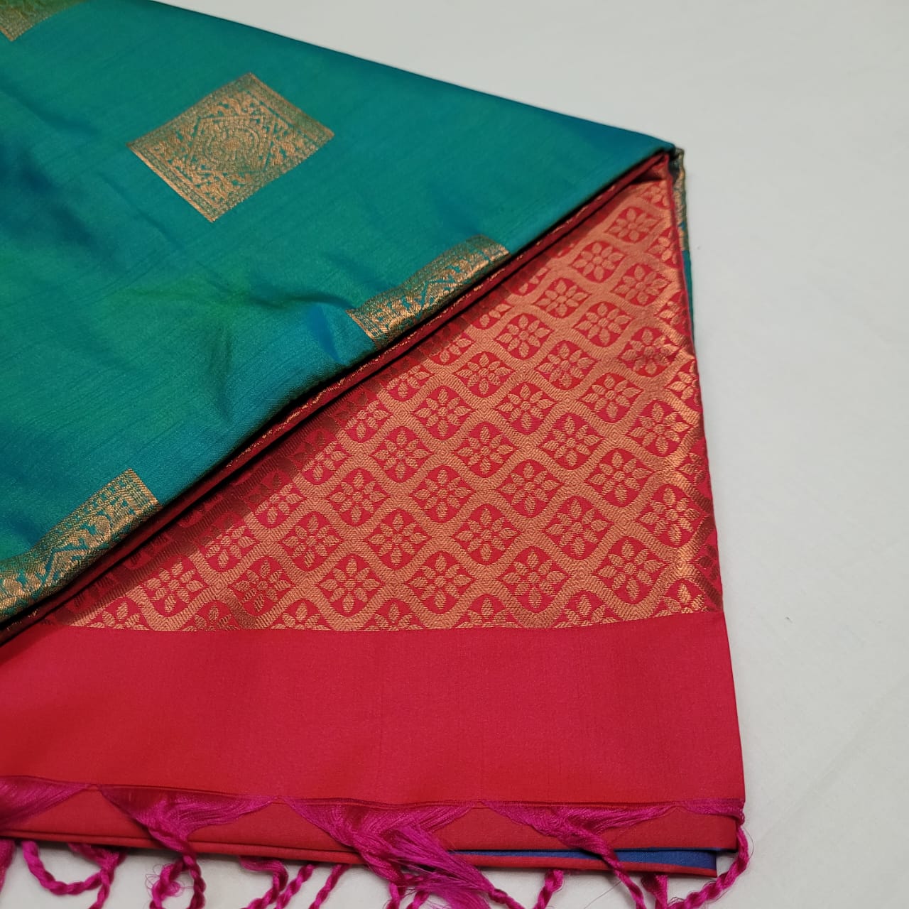 Teal green and red soft silk saree with square motifs