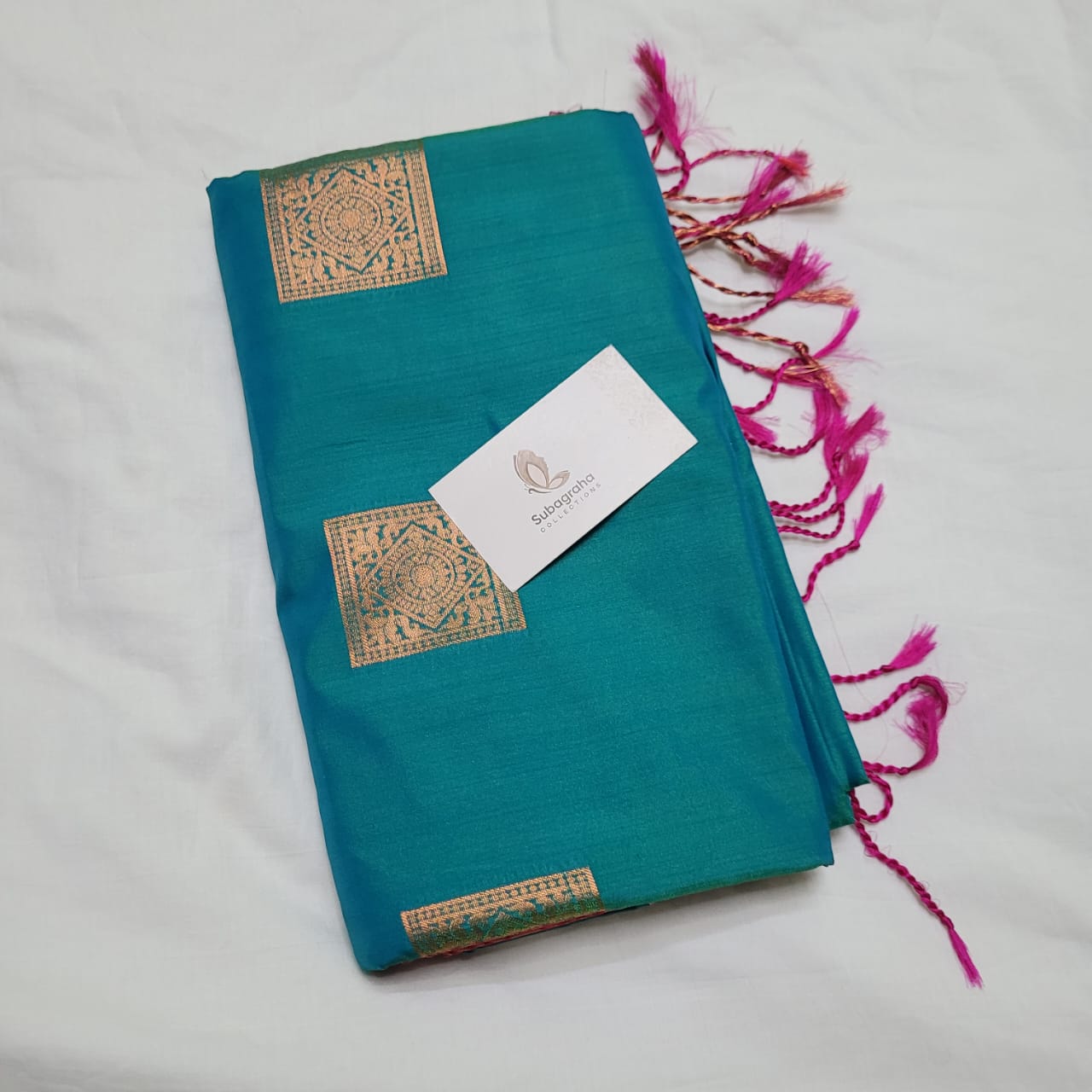 Teal green and red soft silk saree with square motifs