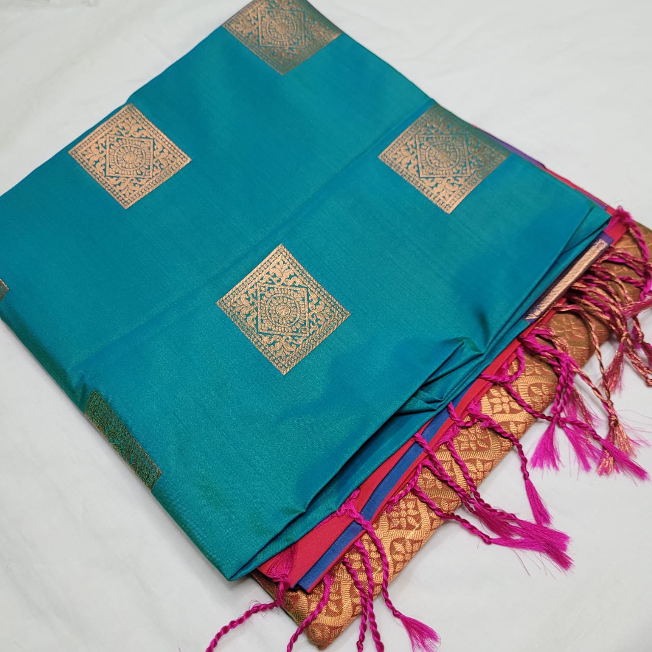 Teal green and red soft silk saree with square motifs