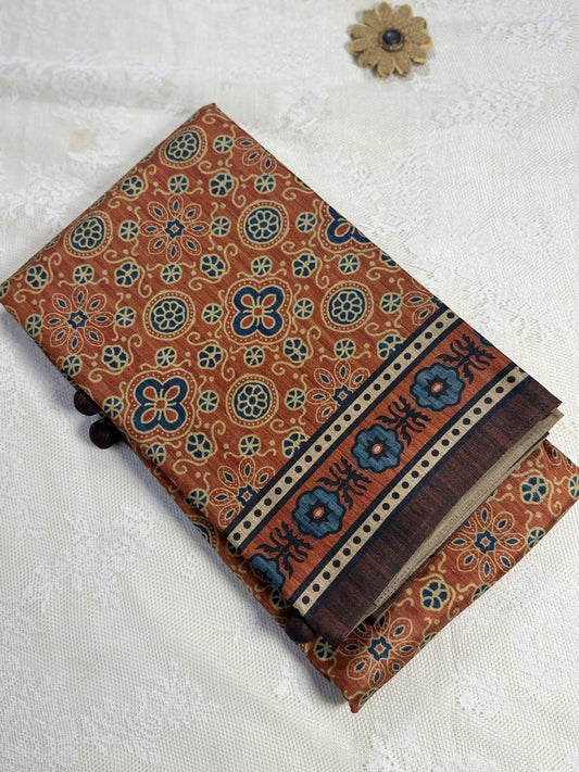 Hemali (Mughal Ajrakh Mul Cotton Saree): Copper Orange Saree with Gold and Navy Ajrakh motif body and Coffee Brown and Orange Border and Pallu