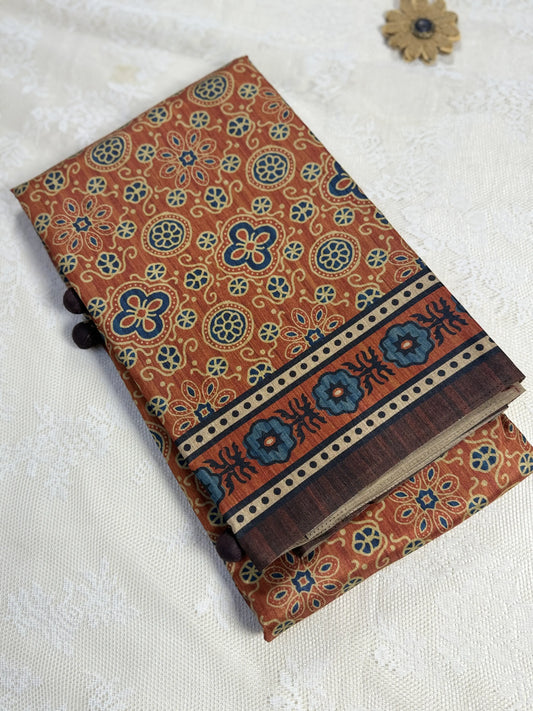 Hemali (Mughal Ajrakh Mul Cotton Saree): Copper Orange Saree with Gold and Navy Ajrakh motif body and Coffee Brown and Orange Border and Pallu