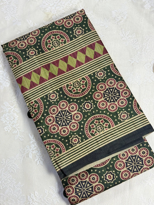 Hemali (Mughal Ajrakh Mul Cotton Saree): Dark betel green Saree with Gold and Red Ajrakh motif body and Geometric pattern Border and Pallu