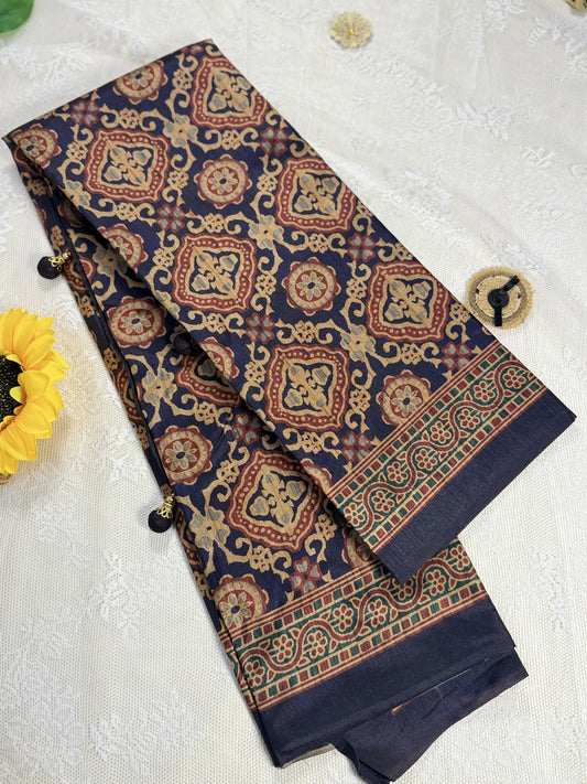 Hemali (Mughal Ajrakh Mul Cotton Saree): Dark Navy Blue Saree with Gold and Red Ajrakh motif body and Gold Stripped border with Gold floral Pallu