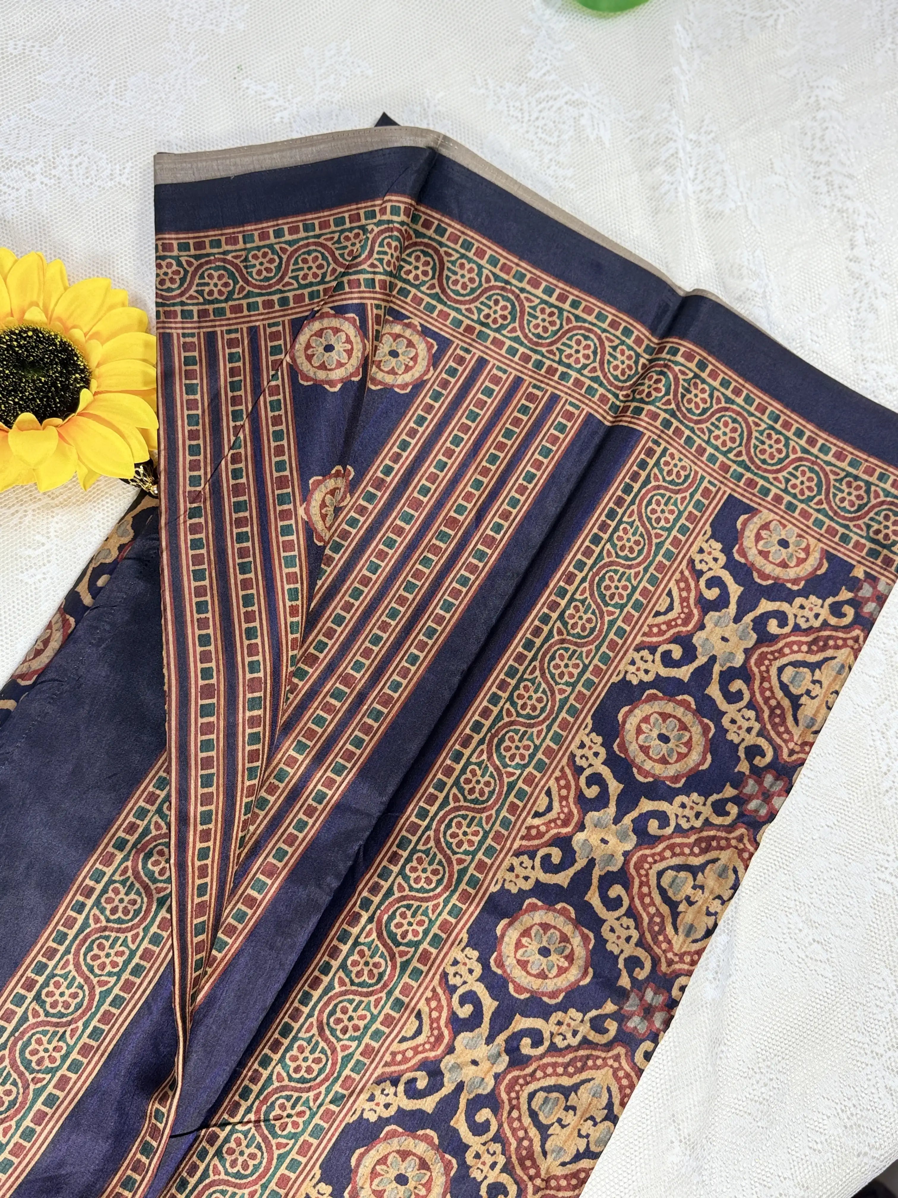 Hemali (Mughal Ajrakh Mul Cotton Saree): Dark Navy Blue Saree with Gold and Red Ajrakh motif body and Gold Stripped border with Gold floral Pallu