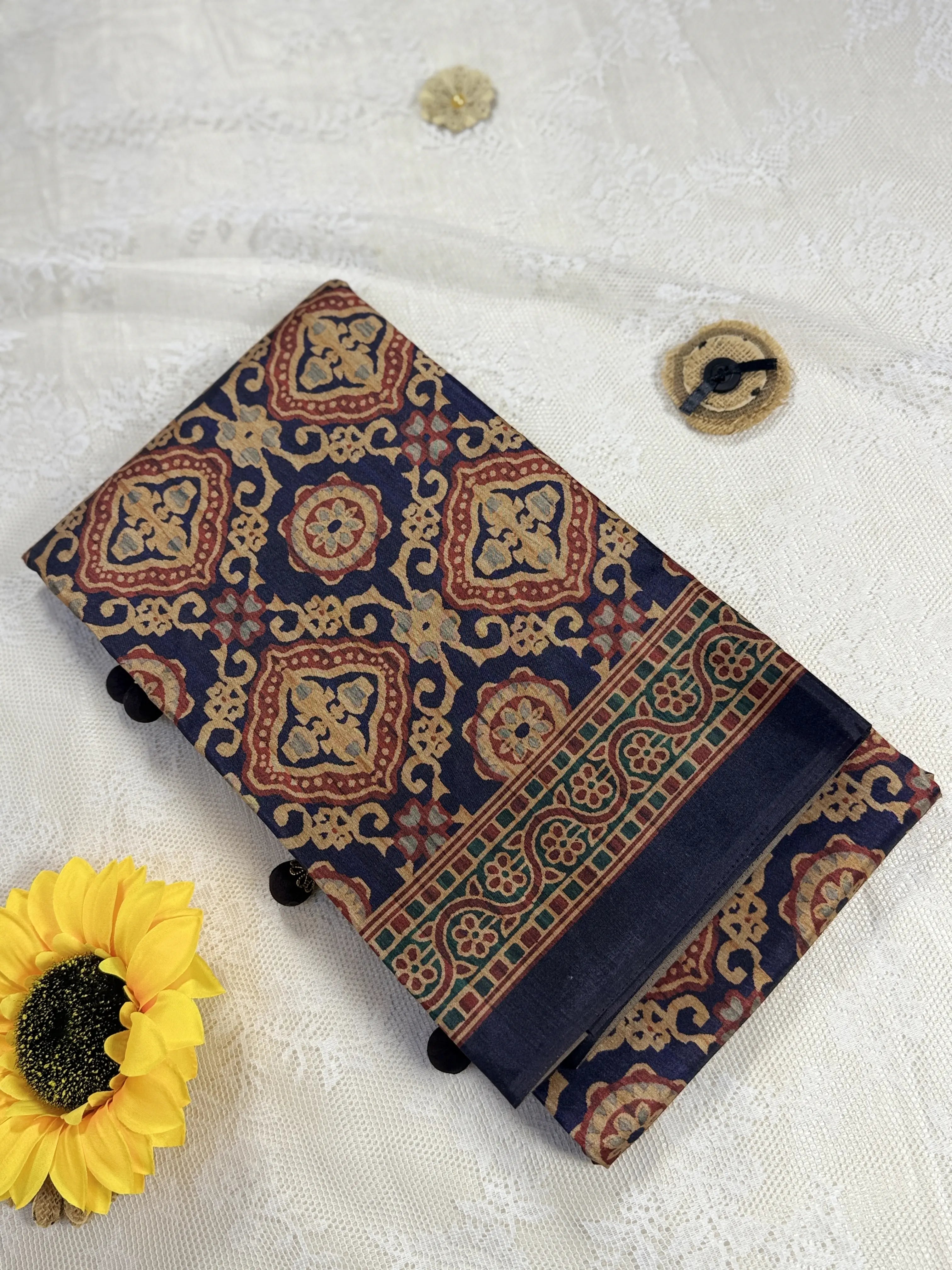 Hemali (Mughal Ajrakh Mul Cotton Saree): Dark Navy Blue Saree with Gold and Red Ajrakh motif body and Gold Stripped border with Gold floral Pallu