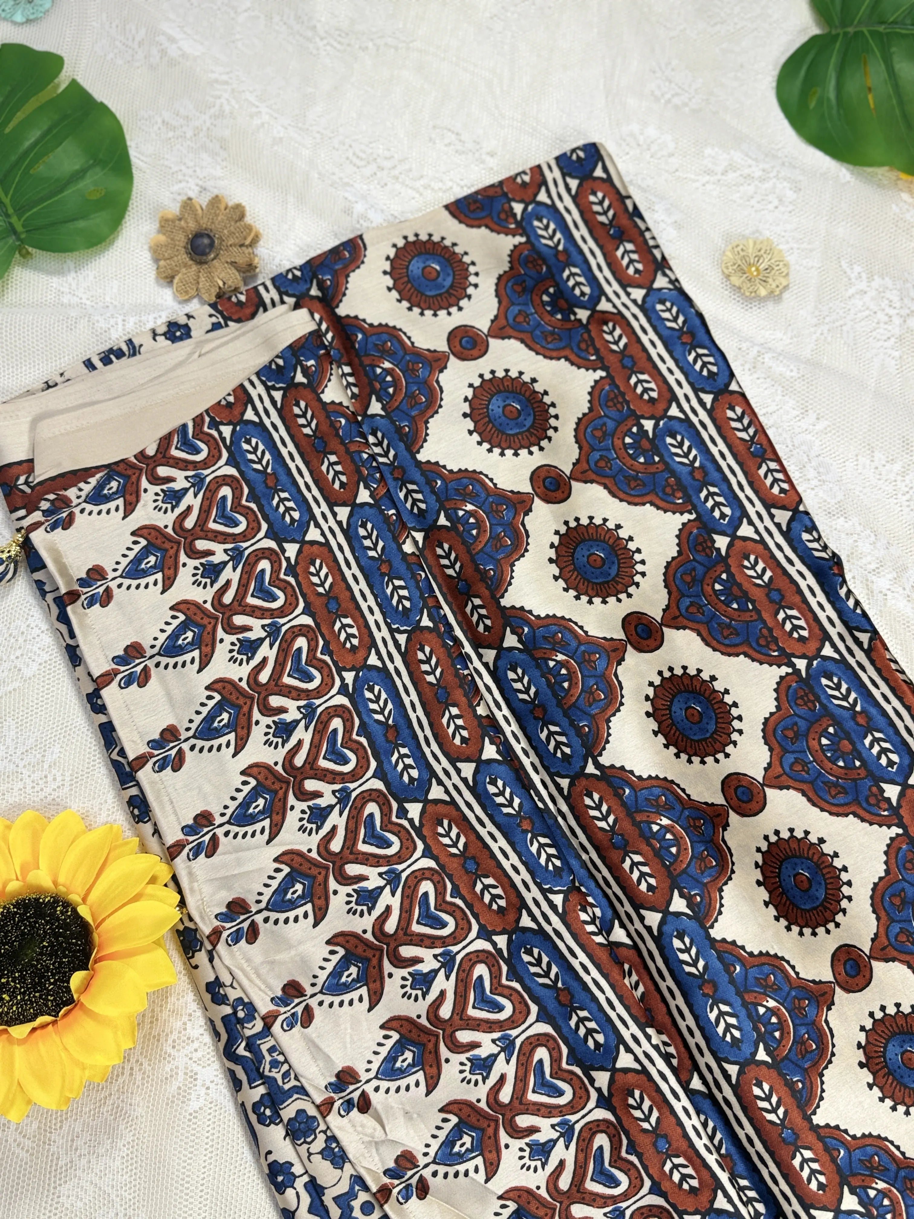 Empress Ajrakh Modal Satin Saree: Pale Gold Saree with Blue Ajrakh Motif Body and Red & Blue Leafy Border with Floral Trance Pallu