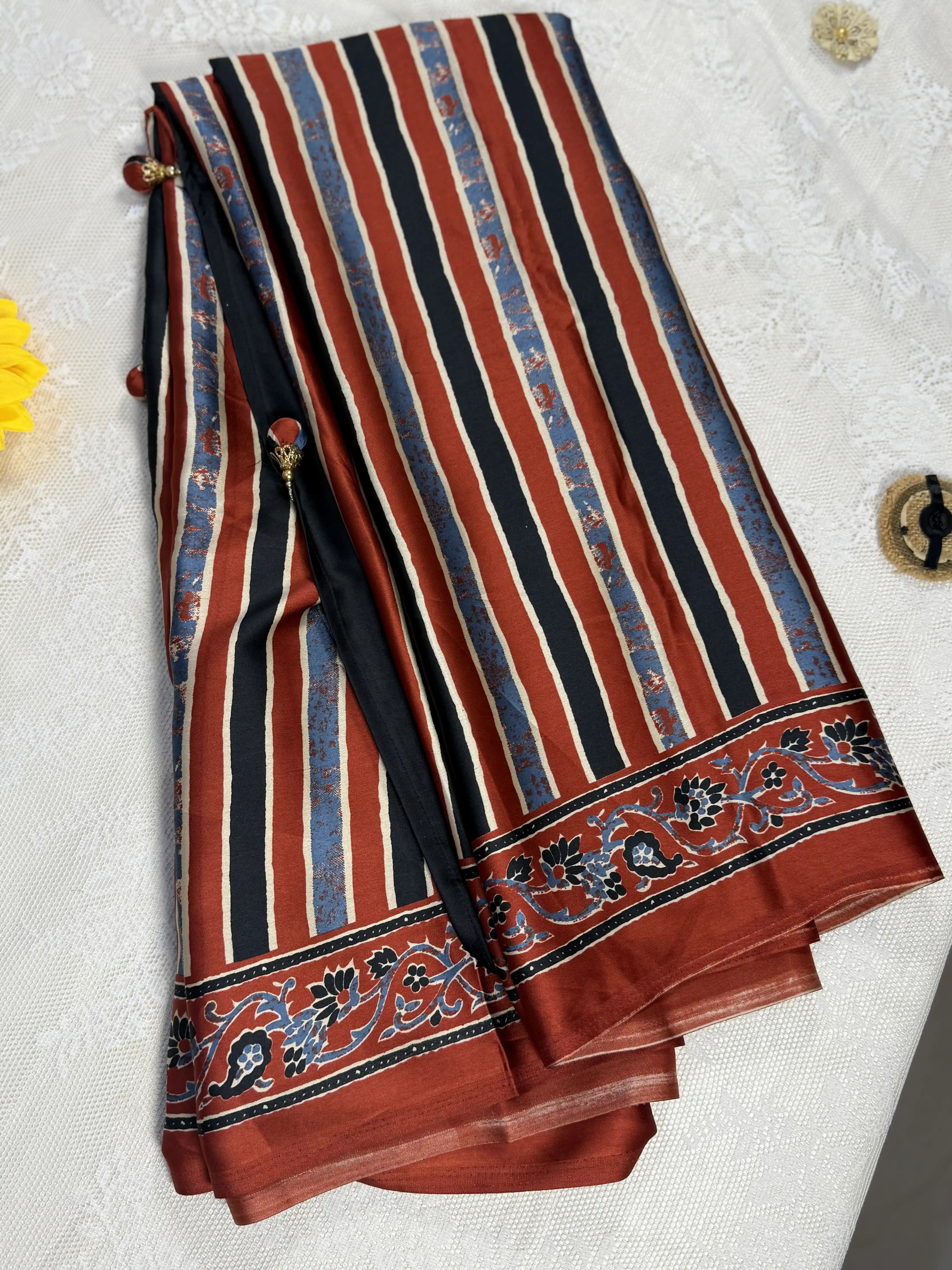 Empress Ajrakh Modal Satin Saree: Pale Gold, Red and Blue Stripped Saree with Blue and Red Marble Body with multi color ajrakh border and pallu