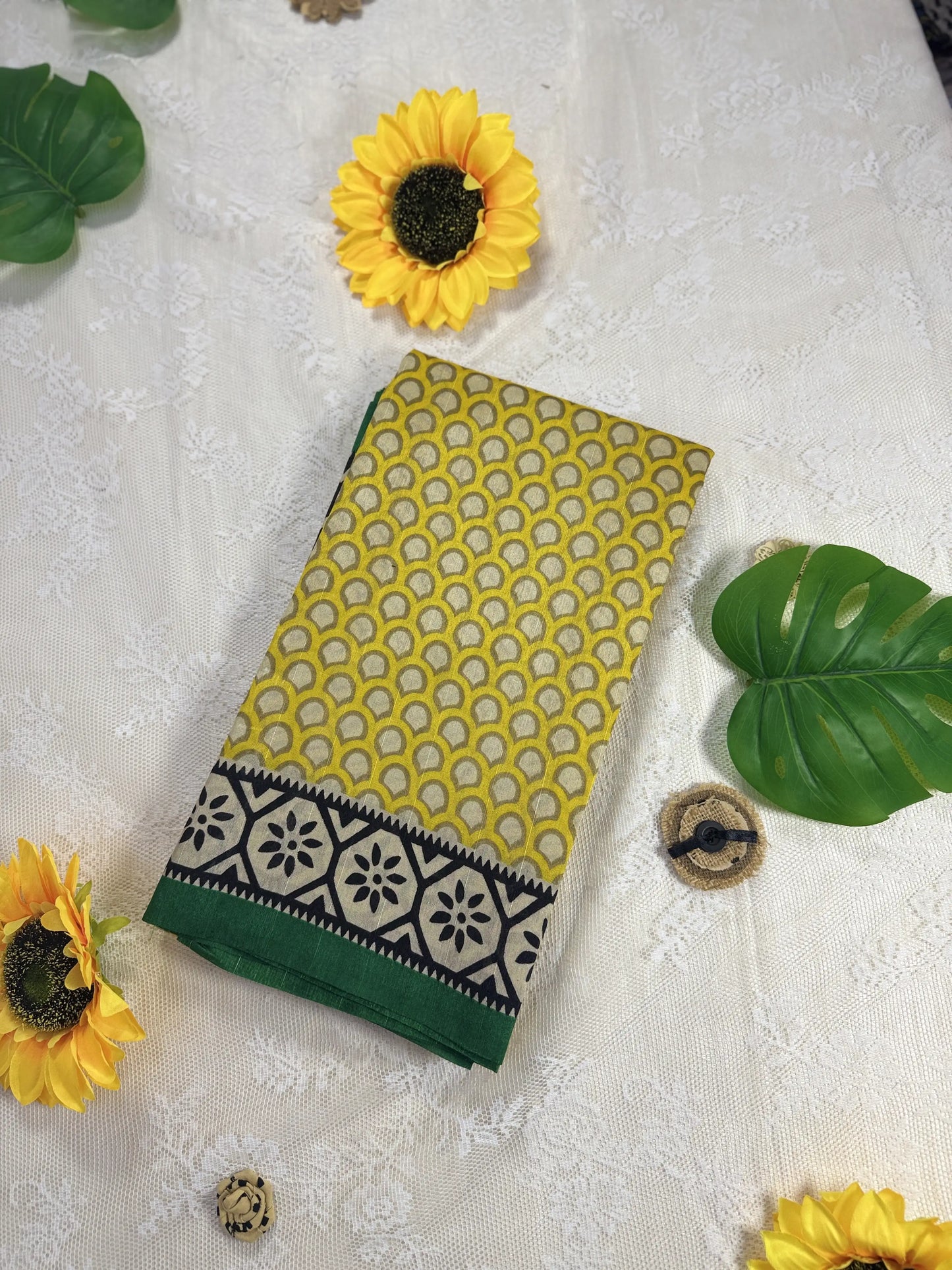 Everyday Tussar Saree: Yellow Saree with polka dot body and white and green floral border with green pallu