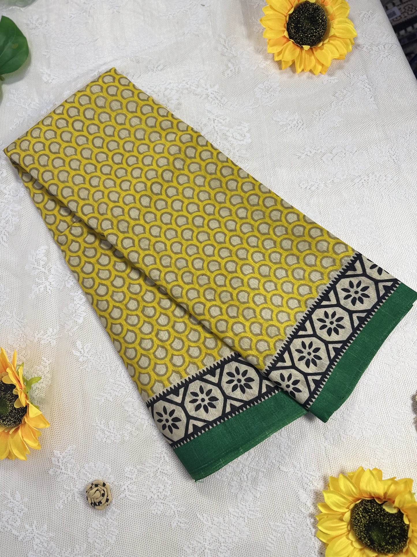 Everyday Tussar Saree: Yellow Saree with polka dot body and white and green floral border with green pallu