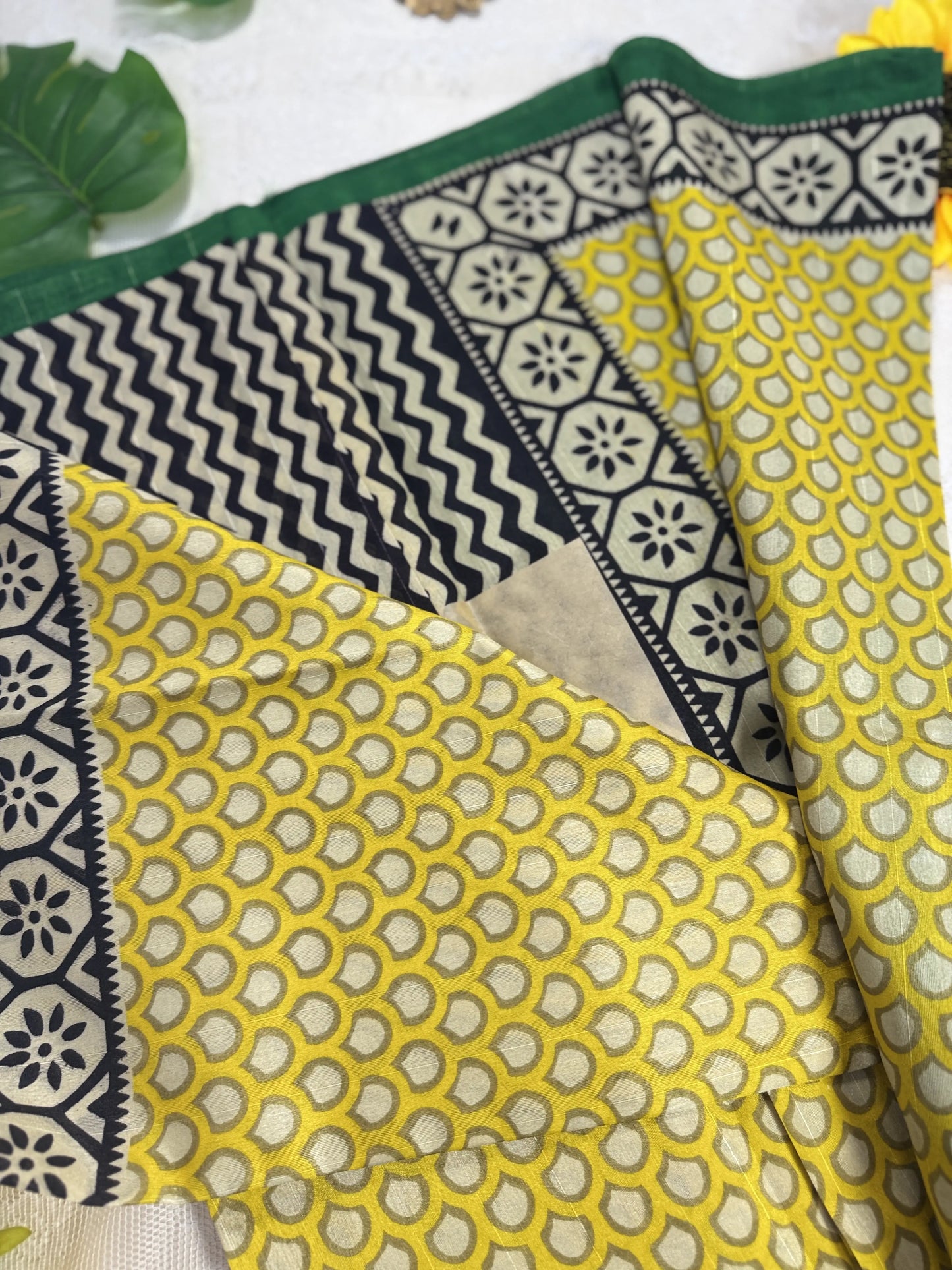 Everyday Tussar Saree: Yellow Saree with polka dot body and white and green floral border with green pallu