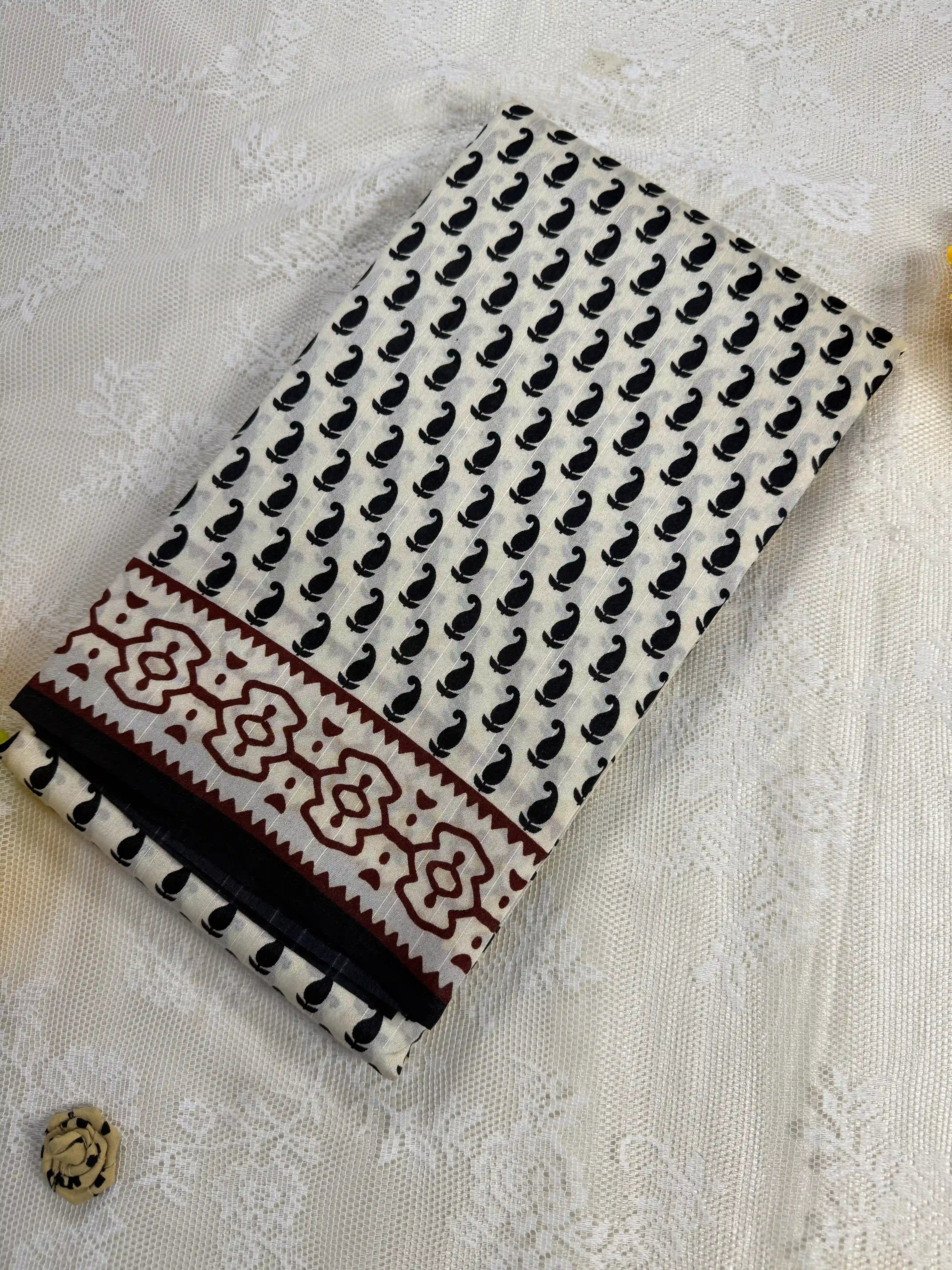 Everyday Tussar Saree: White Saree with black mango motif body and black & red floral border with white flora pallu