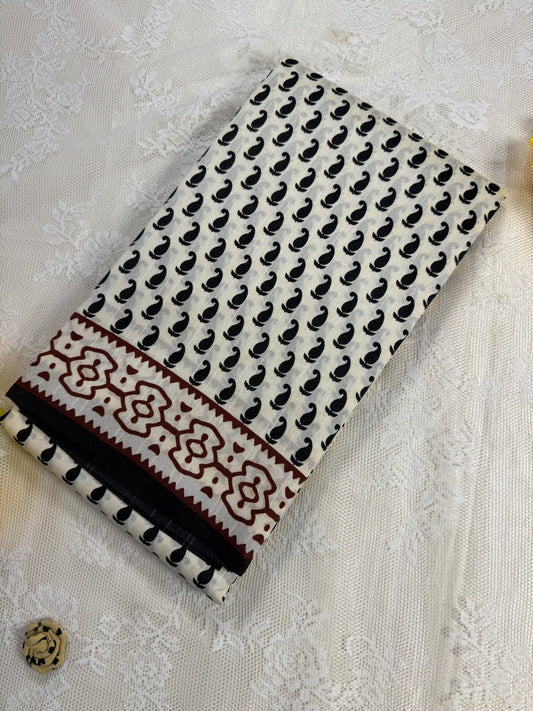 Everyday Tussar Saree: White Saree with black mango motif body and black & red floral border with white flora pallu