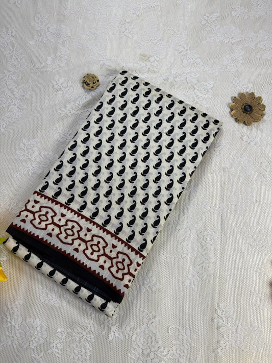 Everyday Tussar Saree: White Saree with black mango motif body and black & red floral border with white flora pallu