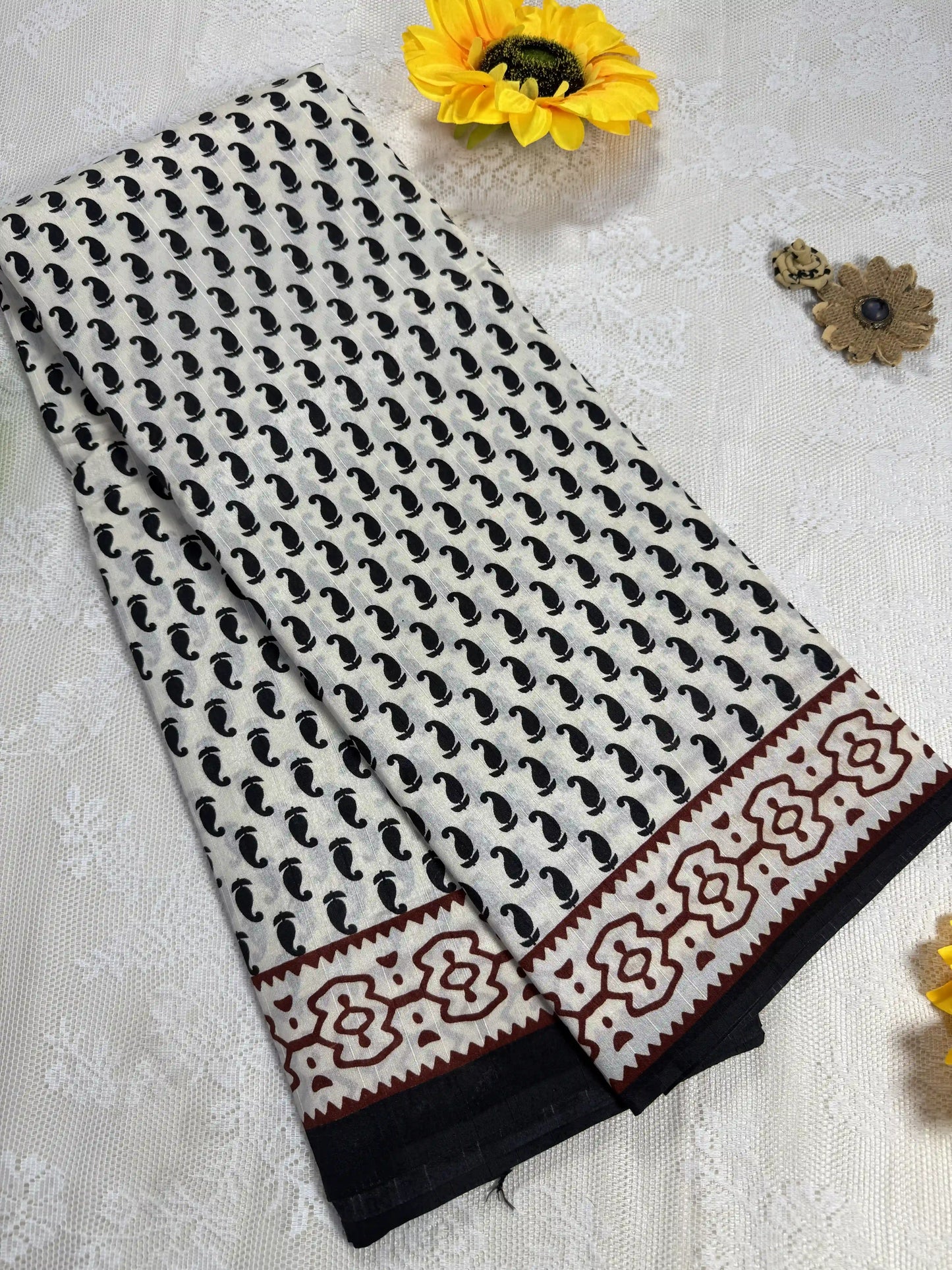 Everyday Tussar Saree: White Saree with black mango motif body and black & red floral border with white flora pallu