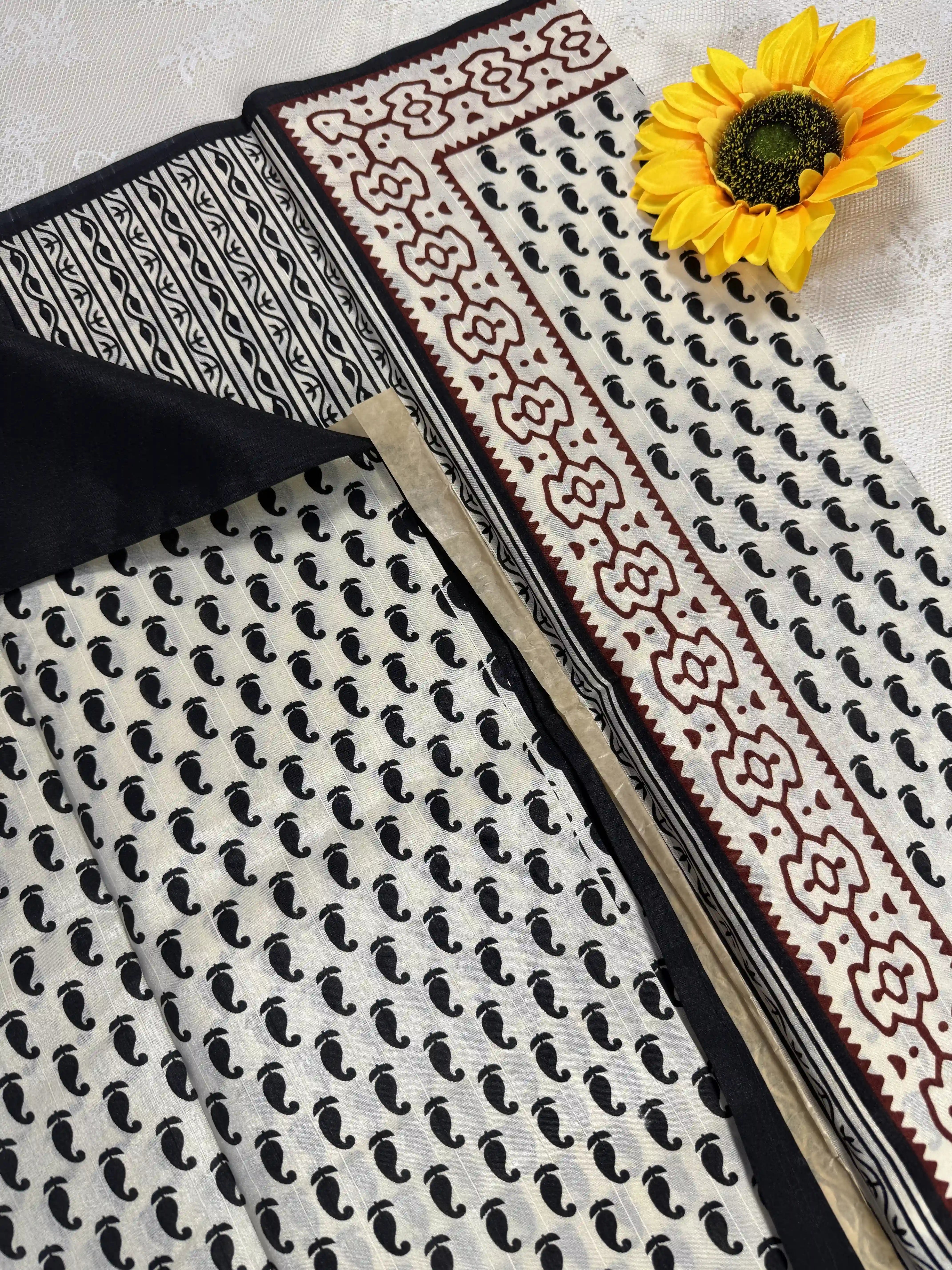 Everyday Tussar Saree: White Saree with black mango motif body and black & red floral border with white flora pallu