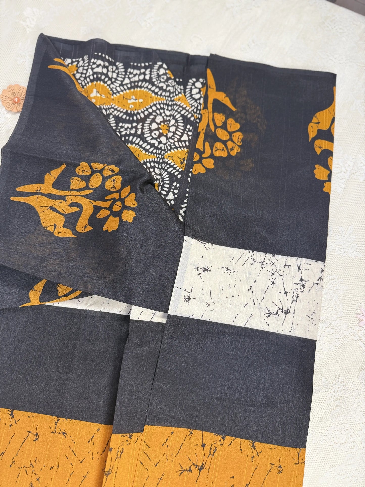 Everyday Tussar Saree: Black Saree with Orange flora Motif and white marble body and plain border