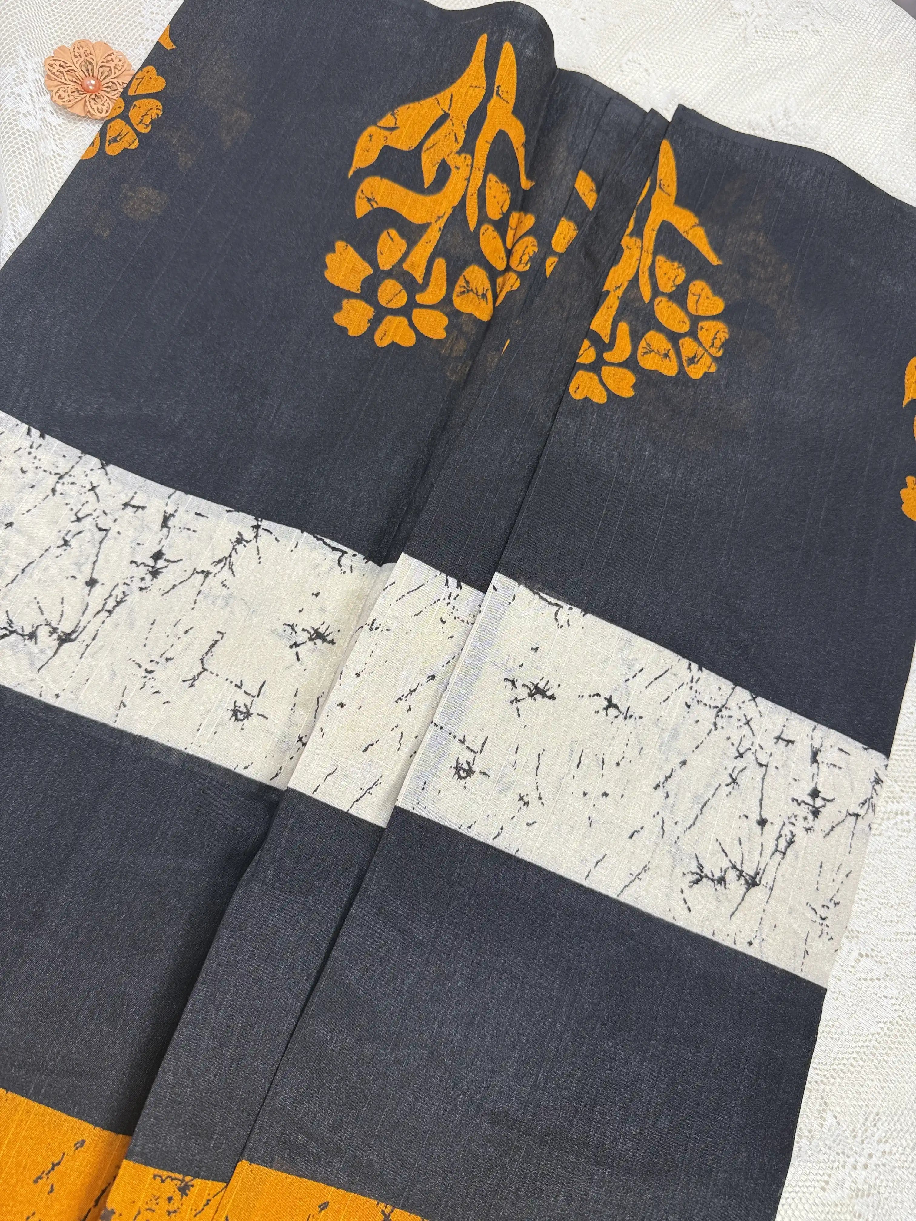 Everyday Tussar Saree: Black Saree with Orange flora Motif and white marble body and plain border