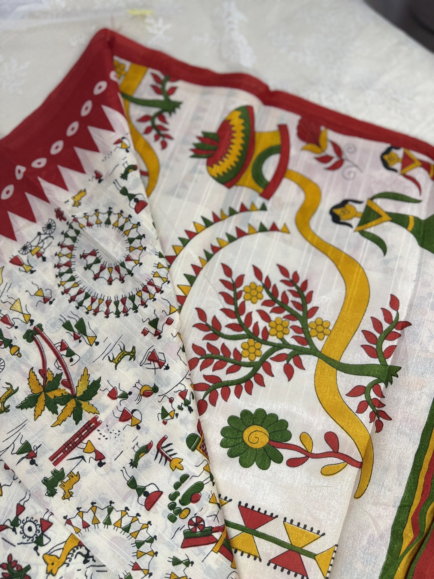 Everyday Tussar Saree: White Saree with warli print body and red temple border and warli print pallu