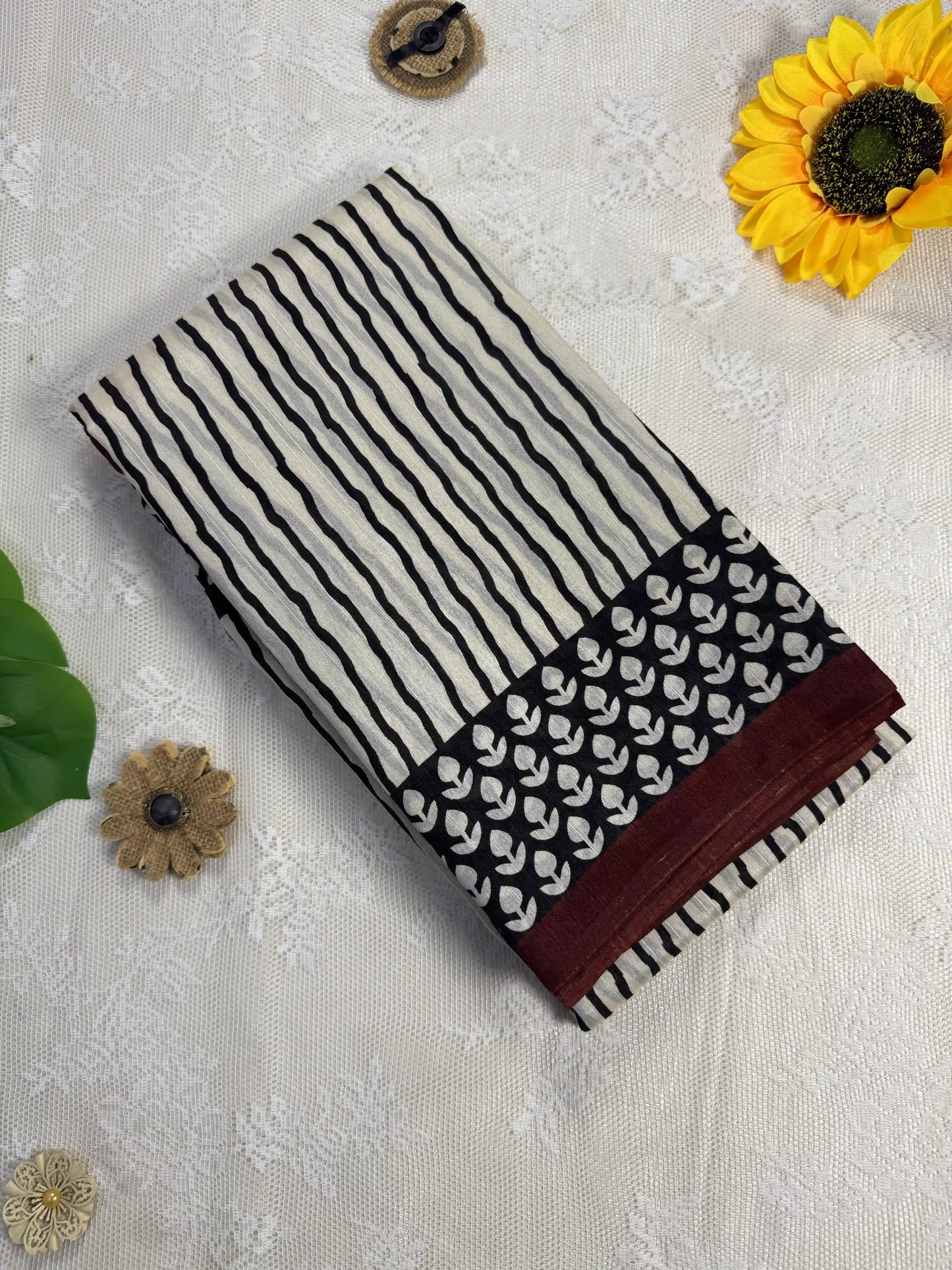 Everyday Tussar Saree: White Saree with black stripes body and black floral border with red wavy stripes pallu
