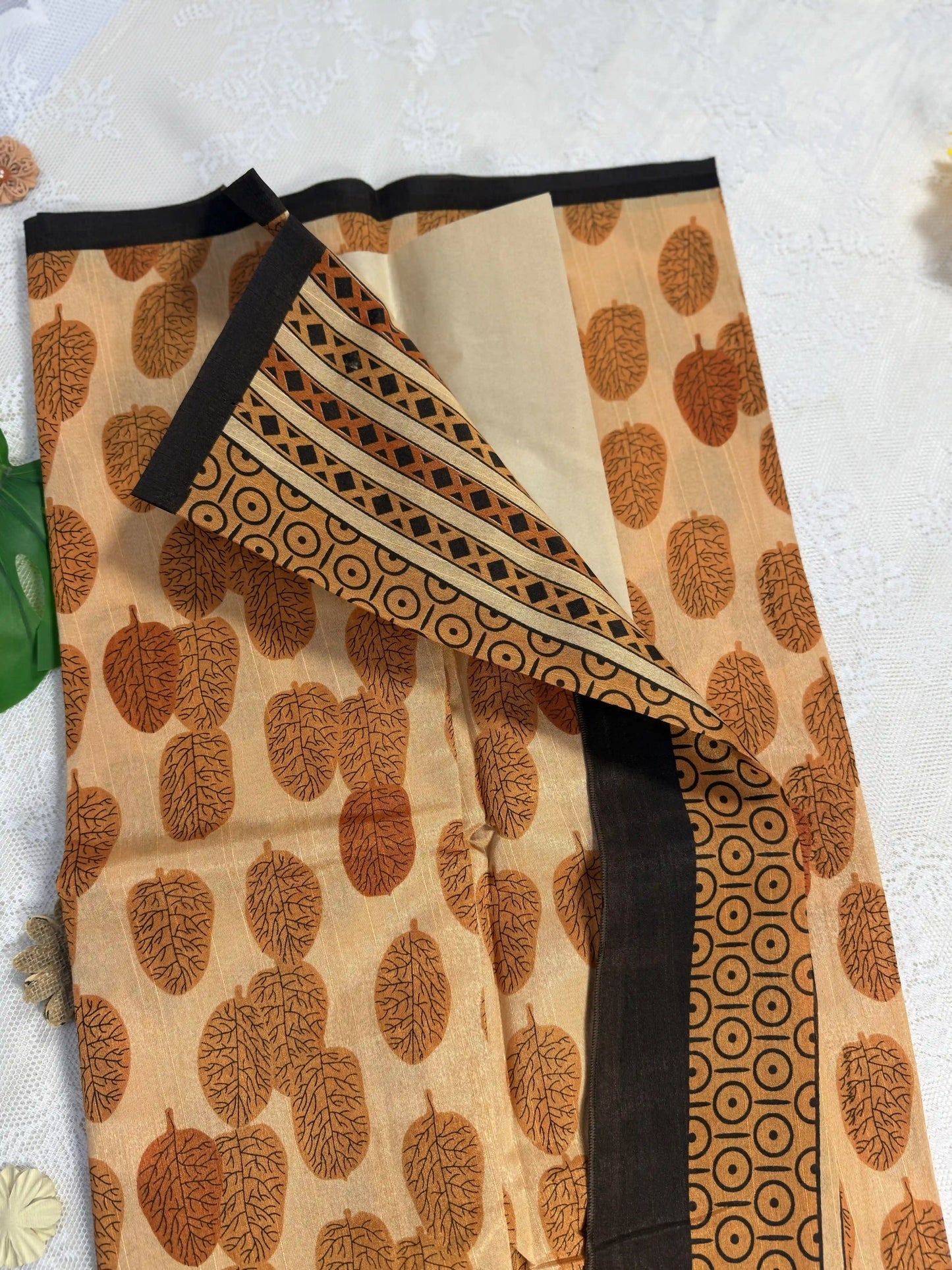 Everyday Tussar Saree: Orange Saree with deep orange leafy motif body black line border with orange and black floral pallu