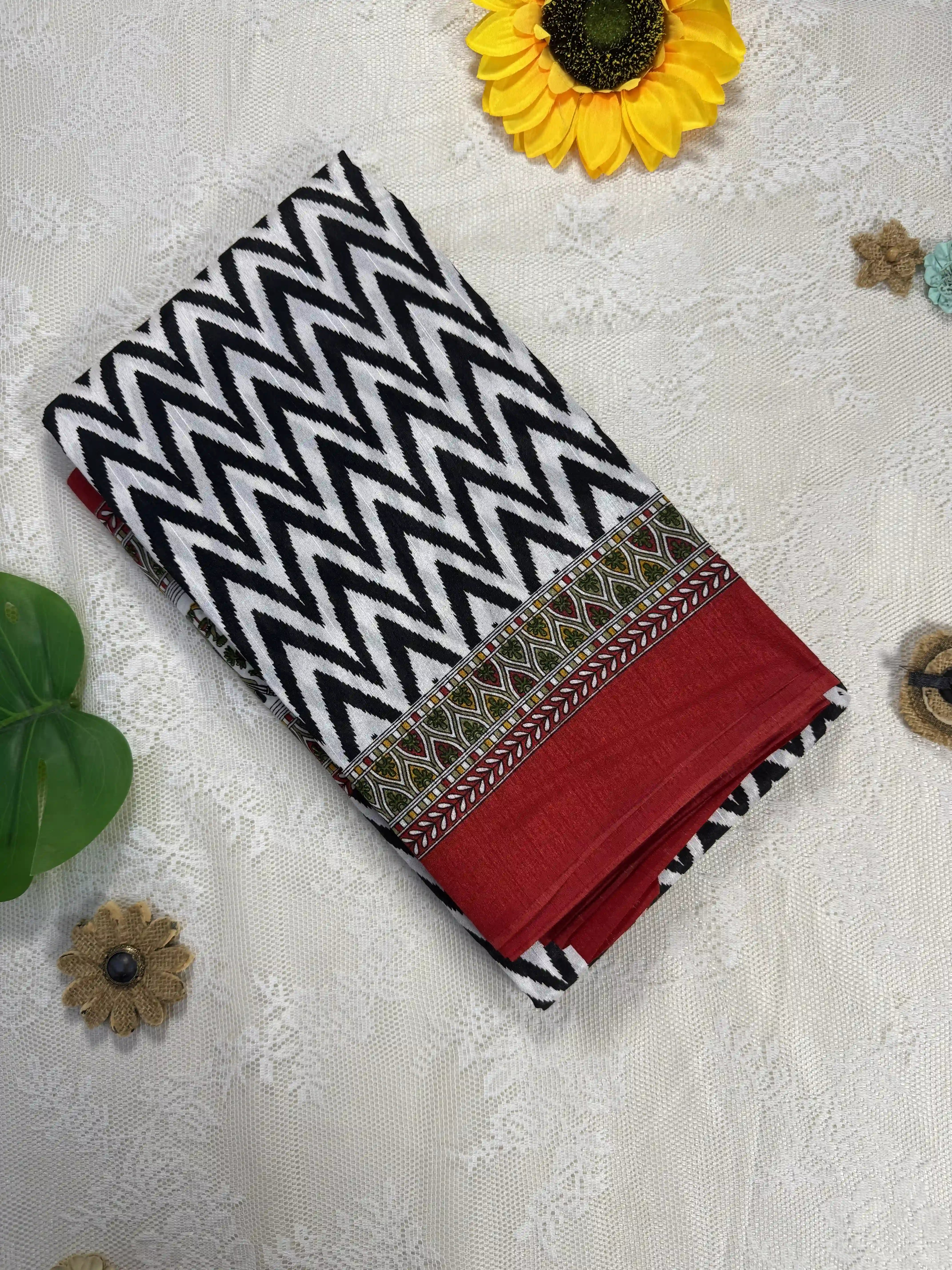 Everyday Tussar Saree: White and Black wavy stripped body with green and red egyptian art border and pallu