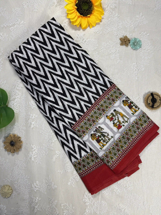 Everyday Tussar Saree: White and Black wavy stripped body with green and red egyptian art border and pallu