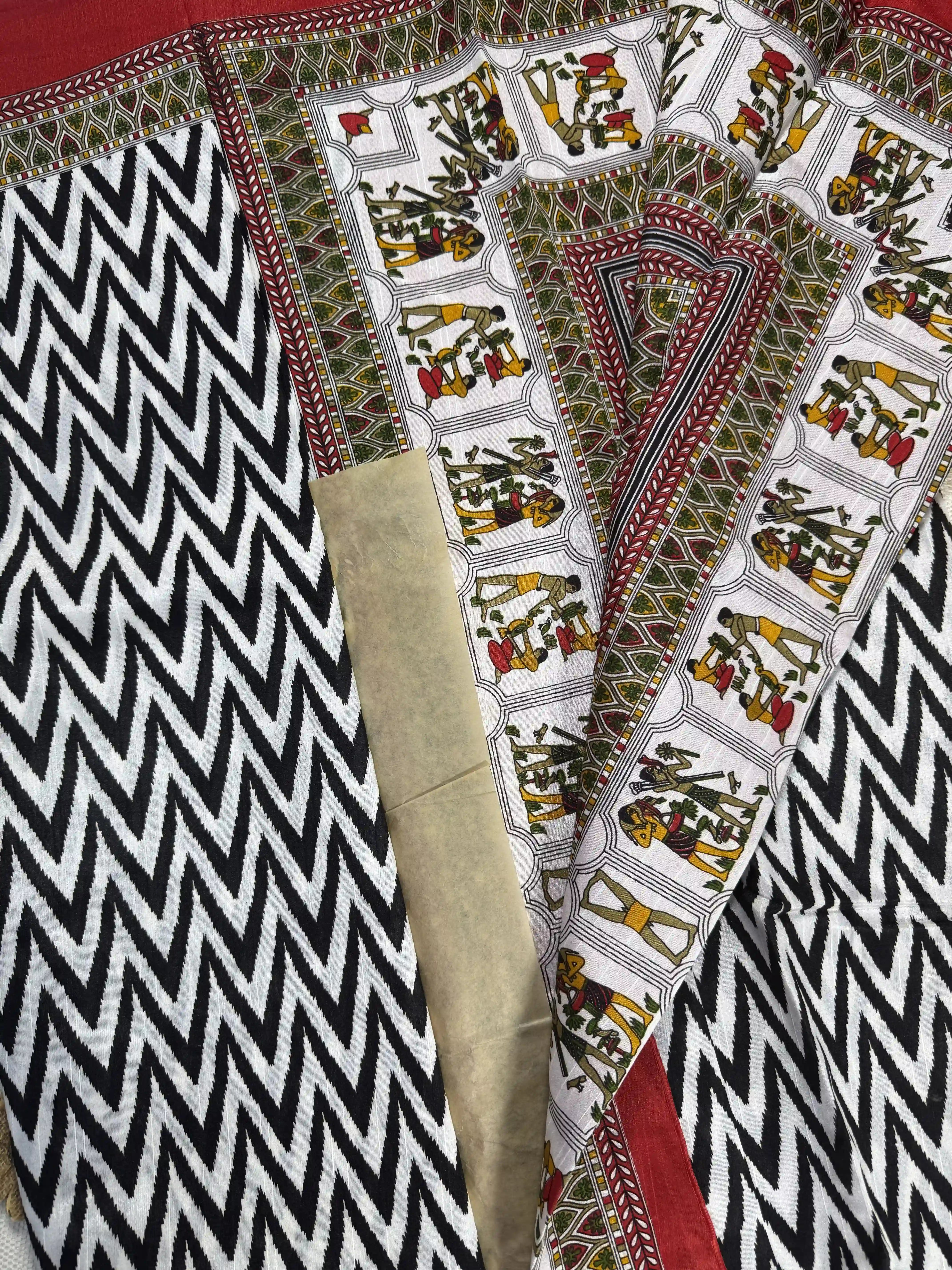 Everyday Tussar Saree: White and Black wavy stripped body with green and red egyptian art border and pallu