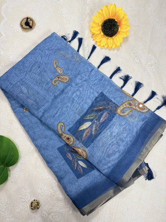 Metallic Blue Silk Cotton Saree with Printed Leaves and Mango Motifs Bordered with Sequence Zari work and Mirror Work