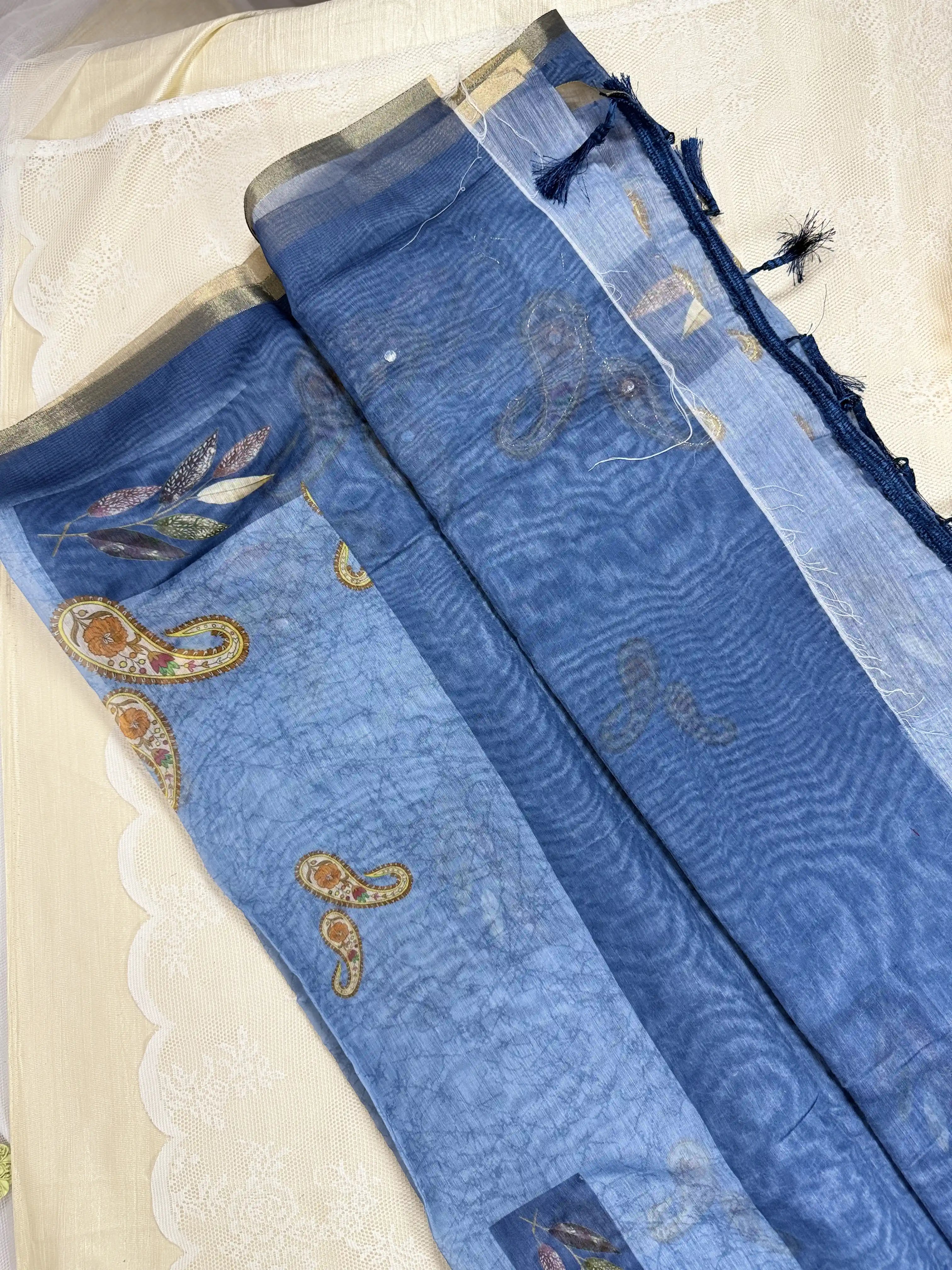 Metallic Blue Silk Cotton Saree with Printed Leaves and Mango Motifs Bordered with Sequence Zari work and Mirror Work