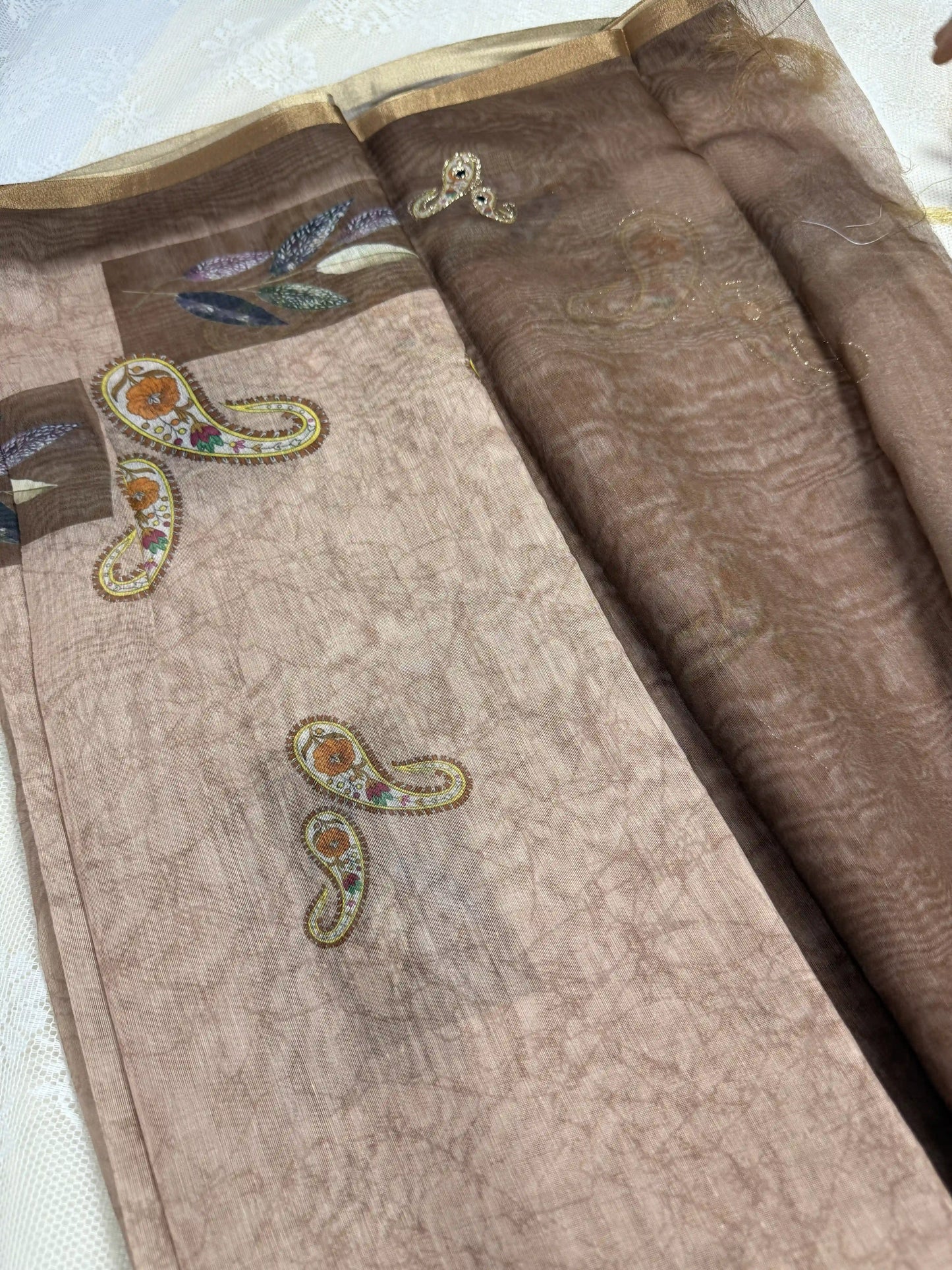 Metallic Brown Silk Cotton Saree with Printed Leaves and Mango Motifs Bordered with Sequence Zari work and Mirror Work