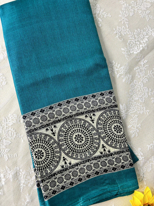 Teal blue plain body khadi silk saree with warli print border and pallu